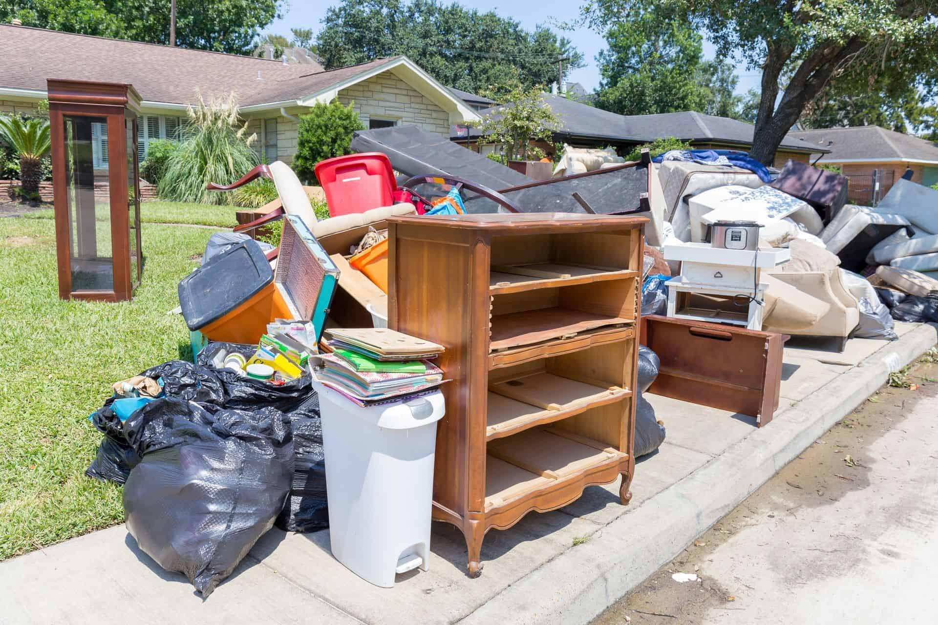 Furniture And Trash Piled Up On Sidewalk